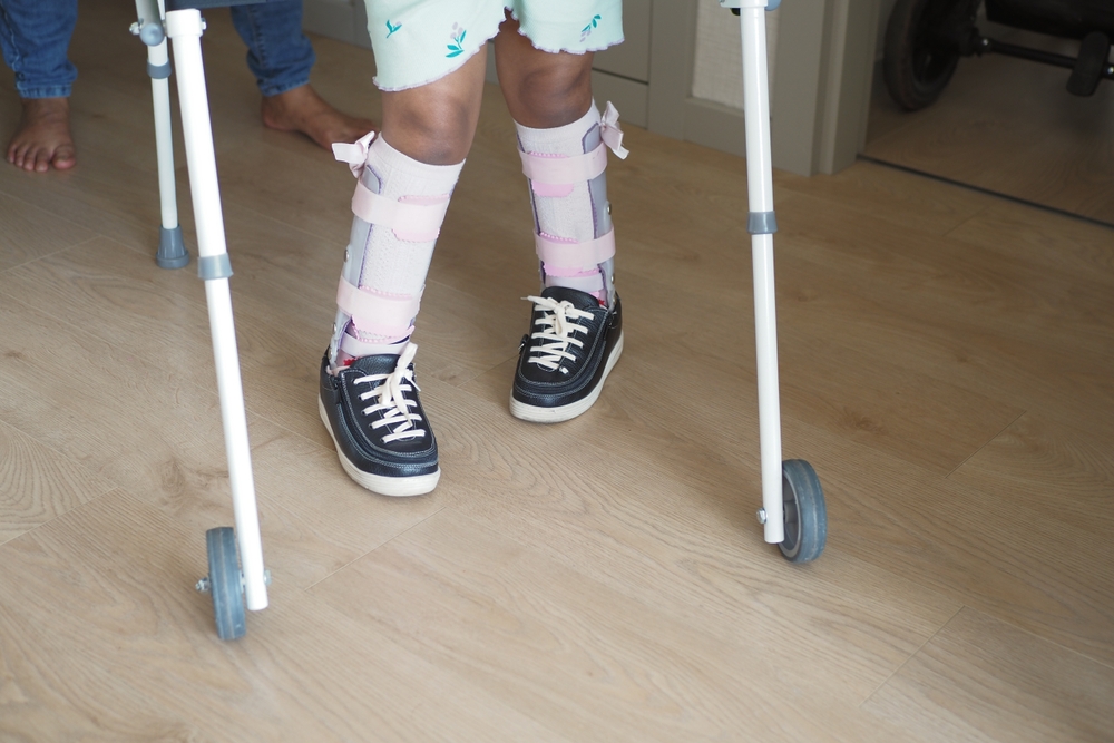 Young,child,using,walker,for,supportive,mobility,indoors