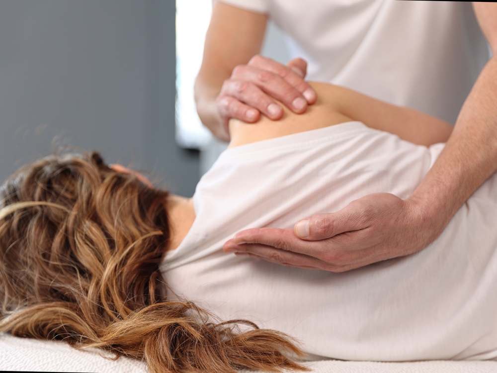 Woman,having,chiropractic,back,adjustment.,osteopathy,,physiotherapy,,sport,injury,rehabilitation